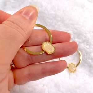 Gold hoop earrings with white sparkly druzy